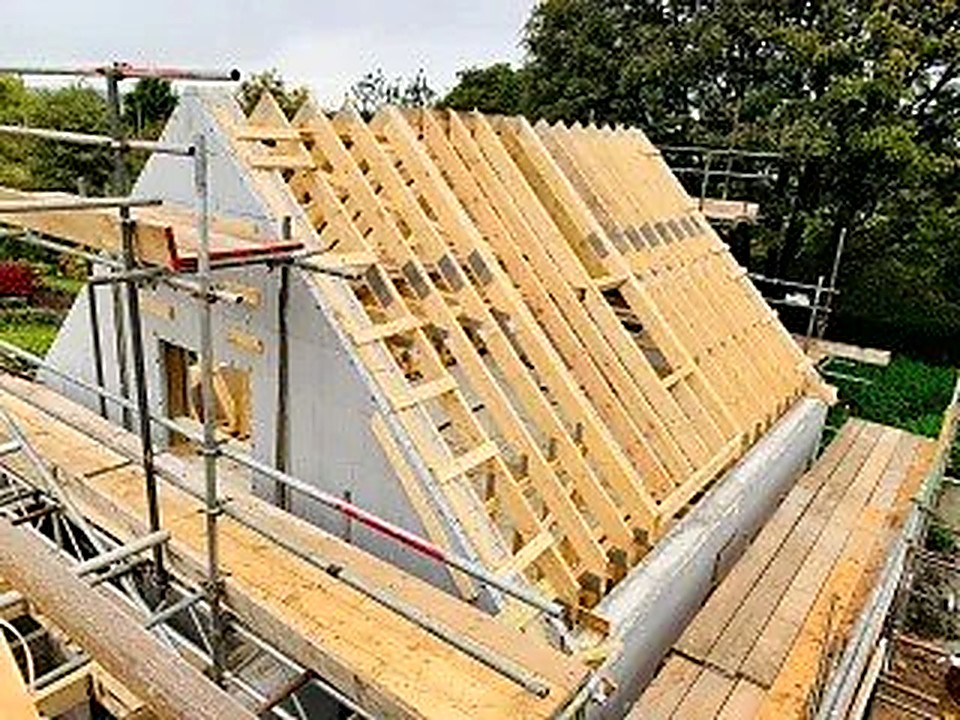 New roof trusses being installed during a stone barn conversion in Derbyshire