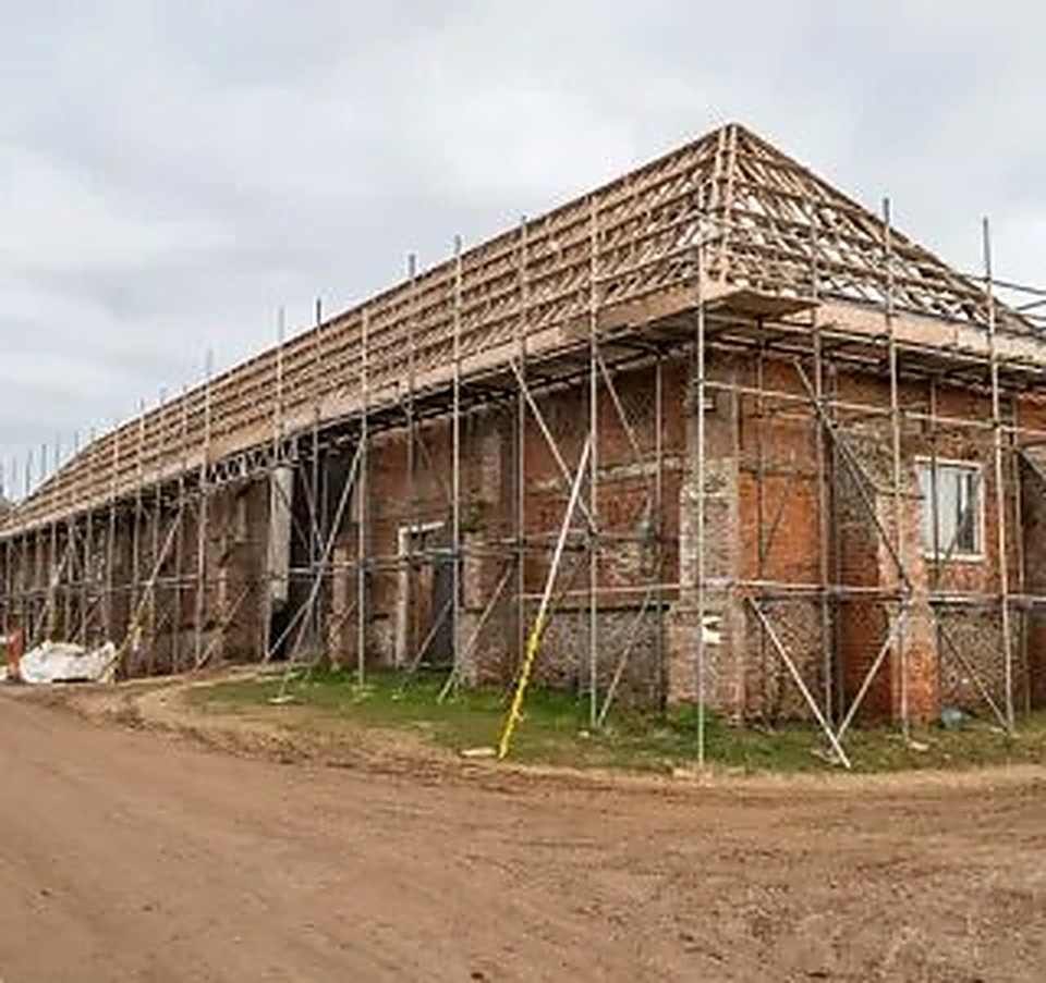 Long stone barn stripped back and scaffolded during conversion near Chesterfield