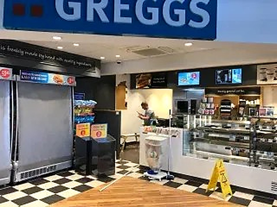 Completed retail shop fit-out with serving counter and display cases in Chesterfield