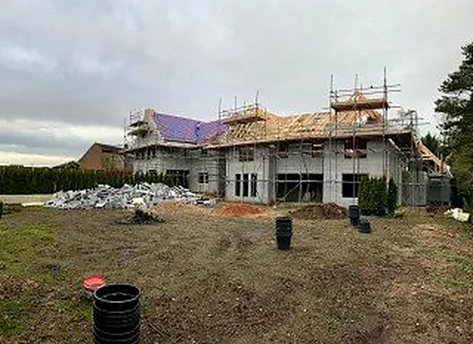 Luxury new build under construction in Derbyshire with timber roof trusses being installed