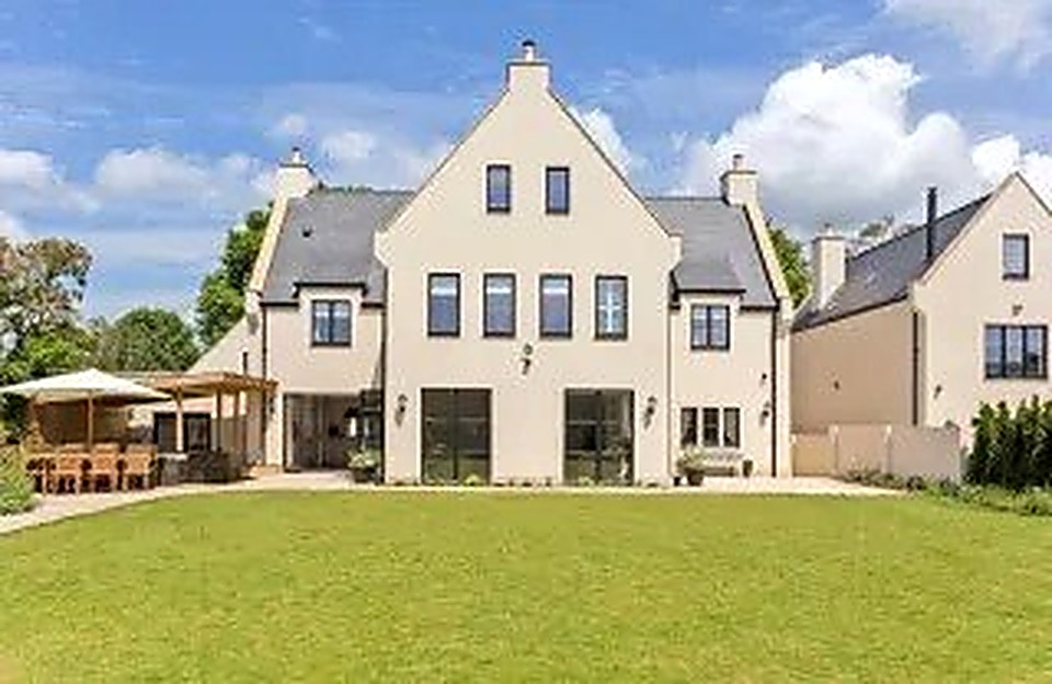 Rear garden and outdoor seating area of a finished luxury new build home in Derbyshire