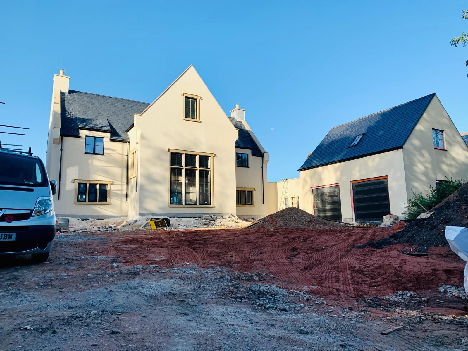 Completed rendered luxury new build with slate roof, stone window surrounds and detached garage, Chesterfield